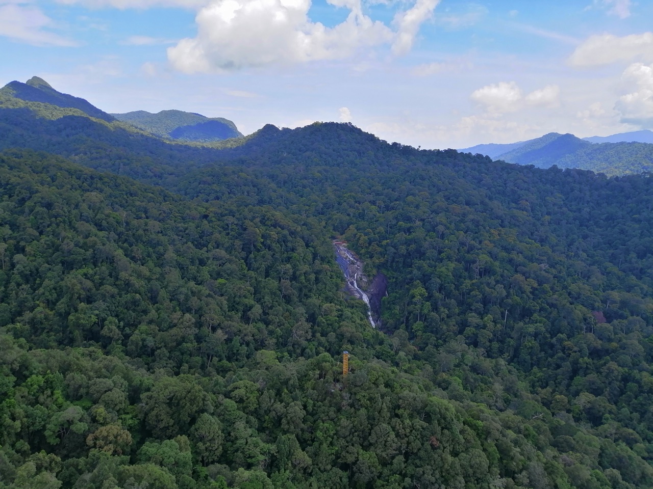 Aerial view of Seven Wells Waterfall (Telaga Tujuh) cascading down the forested Machinchang mountains, Langkawi