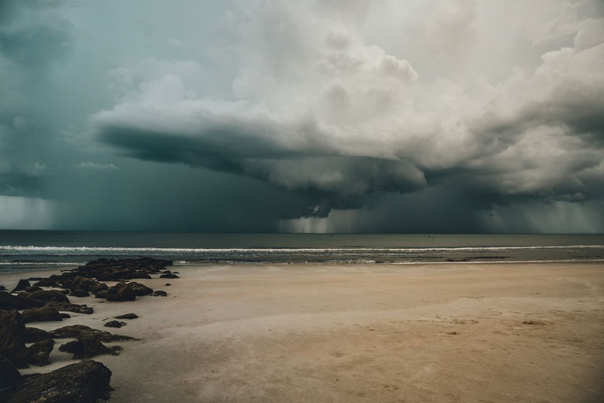 Monsoon storm clouds rolling over a Langkawi beach in the shoulder season